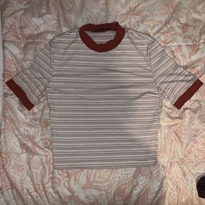 brown, almost Maroon colored and white striped top
